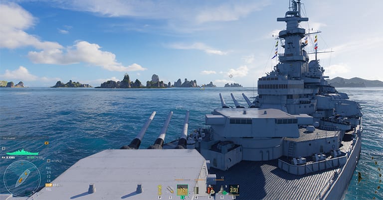 World of Warships gameplay seen over a battleship's forward turrets, its main guns trained ahead towards a distant island chain, with the reload timer and speed indicator visible.